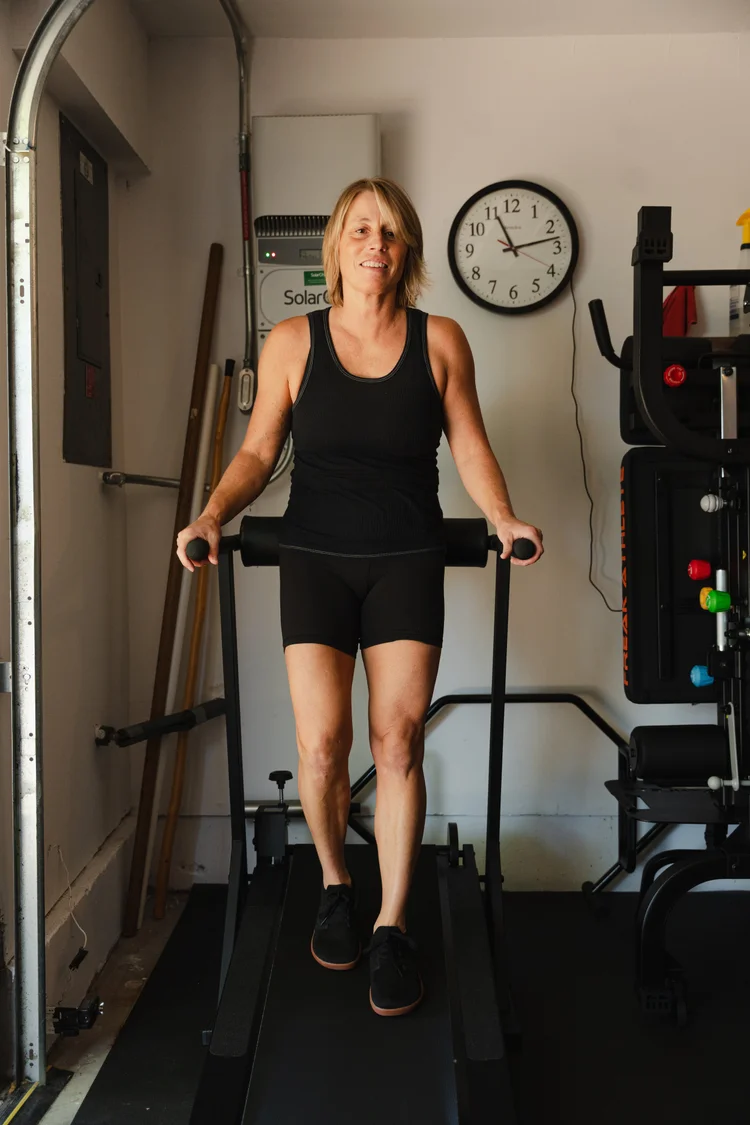 Allison Pelot walking on a treadmill in her training studio